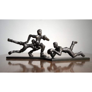 Metal sculpture of rugby players